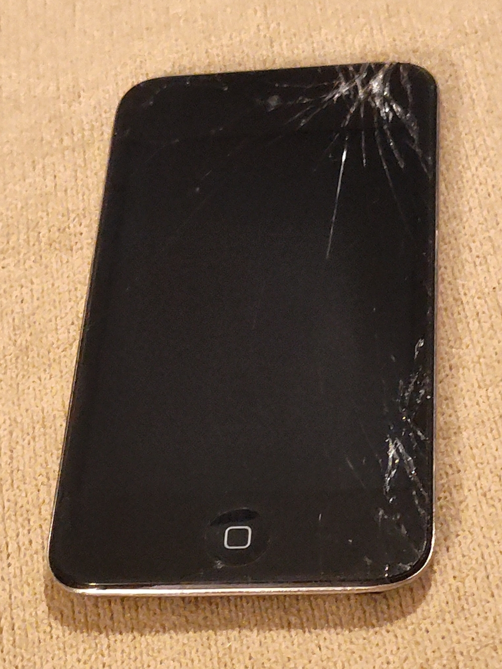 Vintage Apple iPod with Severely Cracked Screen